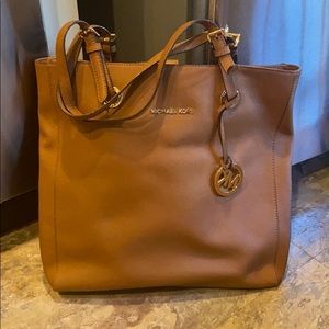 Tan Michael Kors bag.